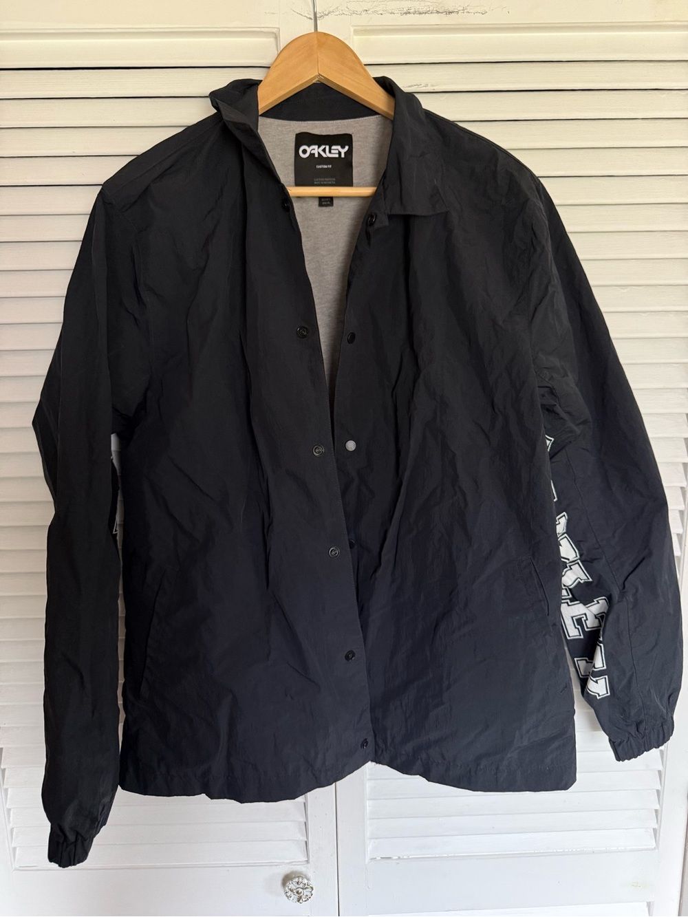 Oakley rain and wind-blocker coaching jacket Black and Gray Logo Label Tee